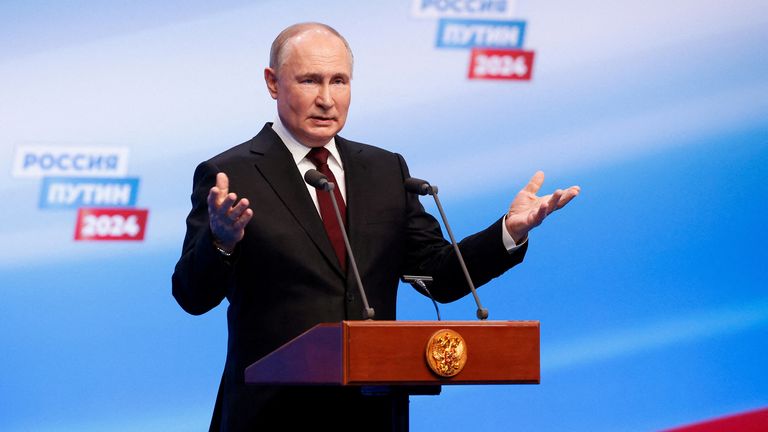 Vladimir Putin speaks at his election campaign headquarters.
Pic: Reuters