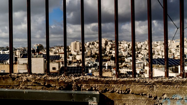 A view of Hebron in the West Bank behind bars.