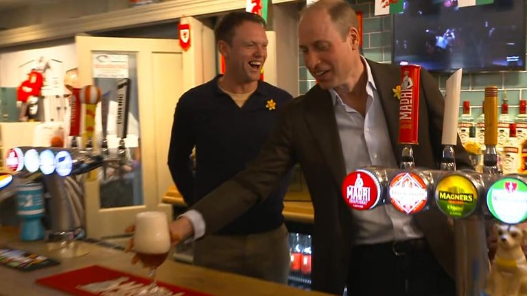 Prince William pulls a pint at The Turf pub in Wrexham.