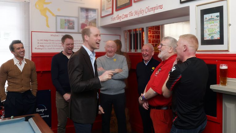 The prince shares a joke with local community members at The Turf pub Pic: PA / Chris Jackson