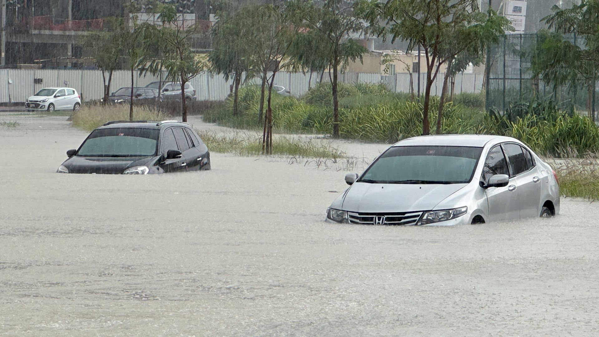 Homes, roads and airport tarmac flooded as Dubai struck by year's rainfall in a day