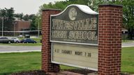 The Pikesville High School sign on the school property. Baltimore County Police Chief Robert McCullough and other local officials speak at a news conference in Towson, Maryland, on Thursday, April 25, 2024. The officials discussed the arrest of a high school athletic director on charges ...that he used artificial intelligence to impersonate a principal on an audio recording that included racist and antisemitic comments. (Lloyd Fox/The Baltimore Sun via AP)