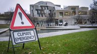 Climate emergency sign during the Cop28 global day of action for climate justice at the Scottish Parliament in Edinburgh. Picture date: Saturday December 9, 2023.