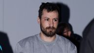 Daniel  Popescu  is led into court during a earlier apperance.
Pic: Athena /Rex Features