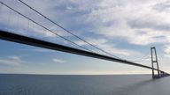 Great Belt Bridge in Denmark on a summer&#39;s day as seen from a passing ferry.

