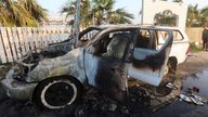 FILE PHOTO: A person looks at a vehicle where employees from the World Central Kitchen (WCK), including foreigners, were killed in an Israeli airstrike, according to the NGO as the Israeli military said it was conducting a thorough review at the highest levels to understand the circumstances of this "tragic" incident, amid the ongoing conflict between Israel and Hamas, in Deir Al-Balah, in the central Gaza, Strip April 2, 2024. REUTERS/Ahmed Zakot/File Photo
