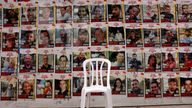 A chair is left in front of posters with pictures of hostages, who were kidnapped during the deadly October 7 attack on Israel by Palestinian Islamist group Hamas, amid the ongoing conflict in Gaza between Israel and Hamas, in Tel Aviv, Israel, April 26, 2024. REUTERS/Shannon Stapleton/File Photo