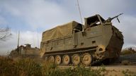 Israeli military personnel drive near the Israel-Gaza border.
Pic: Reuters