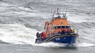 A group of people thought to be migrants are brought in to Dover, Kent, onboard the RNLI Dover Lifeboat following a small boat incident in the Channel. Picture date: Tuesday April 23, 2024.
