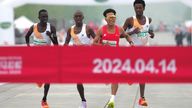 He Jie edges ahead of his African rivals to finish first. Pic: Reuters