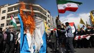 Iranians burn an Israeli flag during a funeral of members of the Islamic Revolutionary Guard Corps who were killed in a suspected Israeli airstrike. Pic: Reuters/Majid Asgaripour/WANA