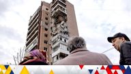Local residents stand in a front of an apartment building hit by a Russian drone strike in Kharkiv.
Pic: Reuters
