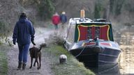 People make their way along the Basingstoke Canal near to Dogmersfield in Hampshire. The UK will remain in a cold snap until the weekend with freezing temperatures set to plummet even further across much of the country. Picture date: Thursday January 18, 2024.
