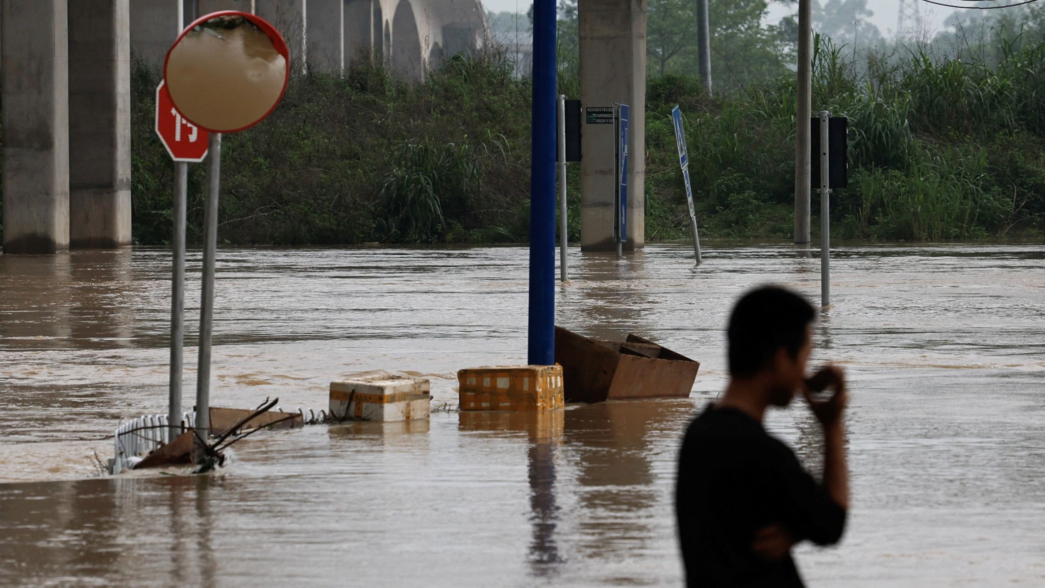 China floods: Four dead as cities submerged after days of record ...