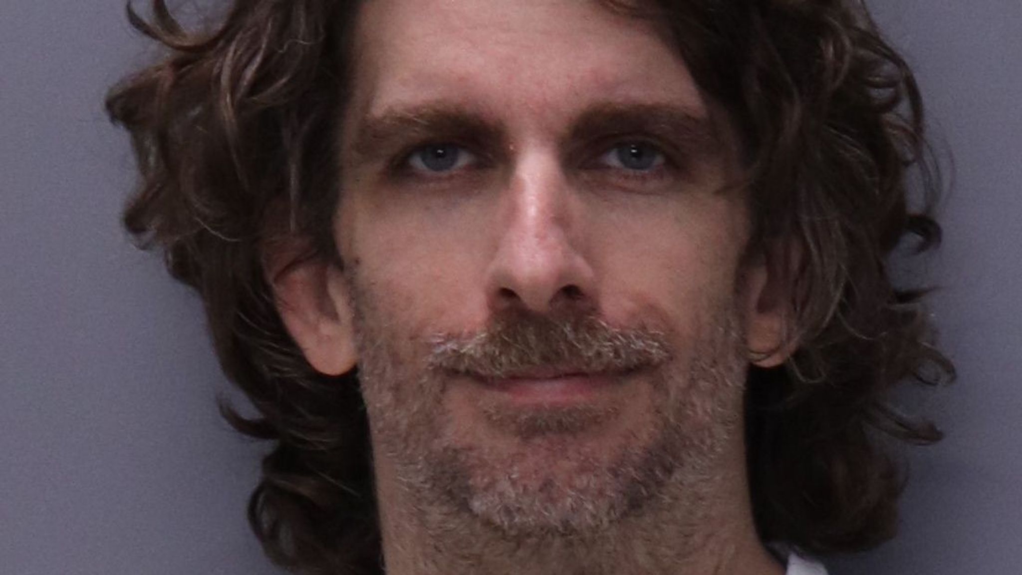 Man throws conspiracy theory pamphlets in the air before setting