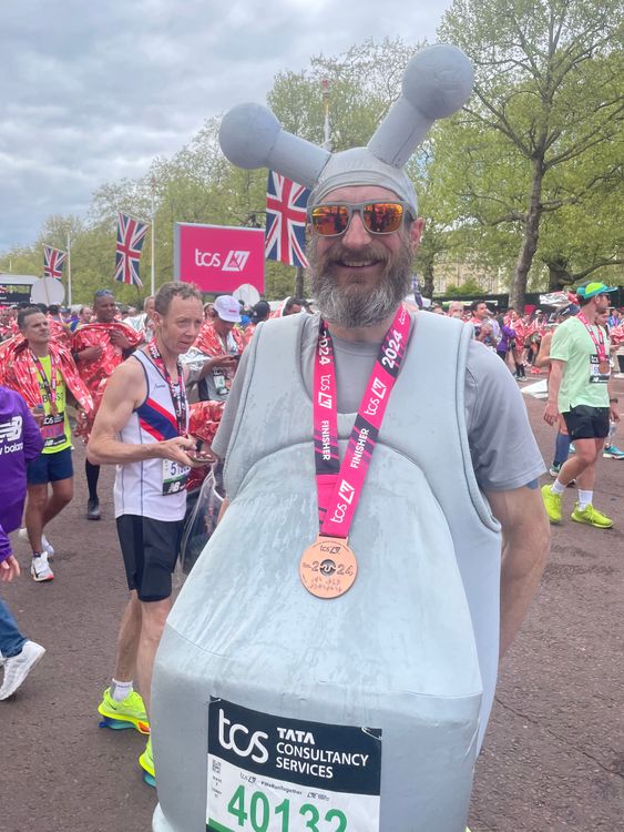 Marcus Mumford, 45, after finishing the TCS London Marathon, dressed as a tap. Picture date: Sunday April 21, 2024. Pic: PA 