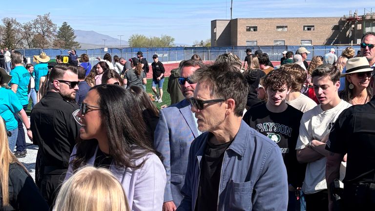 Actor Kevin Bacon, centre, helps fill care packages for his charity in Payson, Utah, while visiting the Utah high school where Footloose was filmed. Pic: Jesse Sorenson via AP