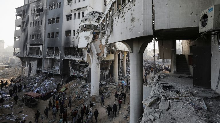 Palestinians inspect damage at Al Shifa Hospital. Pic: Reuters