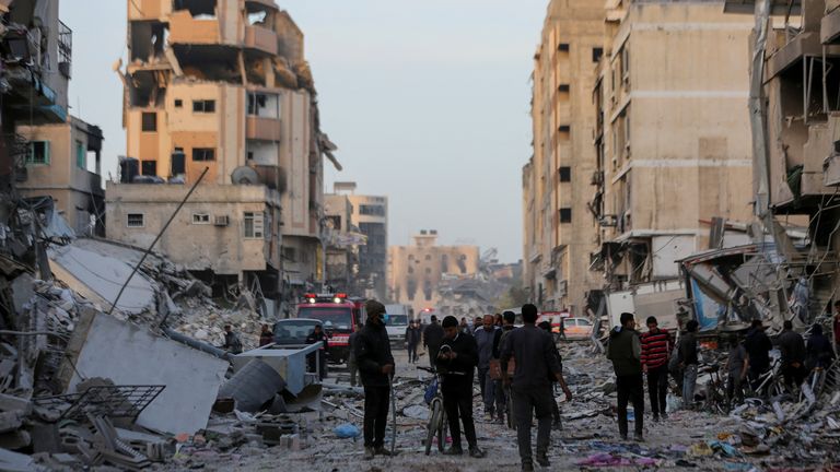 Palestinians inspect damage in the area around Al Shifa Hospital. Pic: Reuters