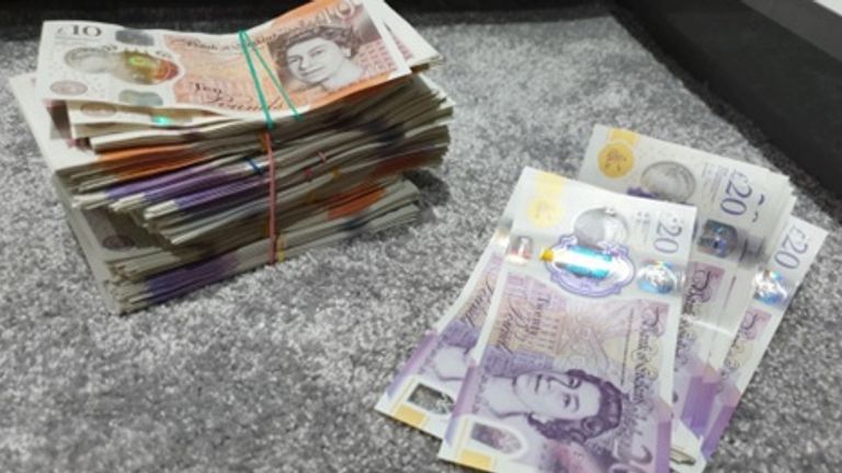 Almost £10,000 in cash which was recovered from the home of Sallem Chaudhri in Blackburn.
Pic: PA