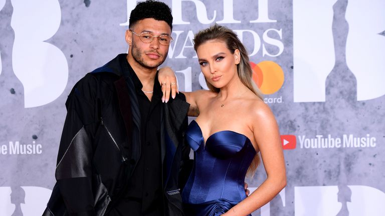 Alex Oxlade-Chamberlain and Perrie Edwards attending the Brit Awards 2019 at the O2 Arena, London. PRESS ASSOCIATION PHOTO. Picture date: Wednesday February 20, 2019. See PA story SHOWBIZ Brits. Photo credit should read: Ian West/PA Wire. EDITORIAL USE ONLY.