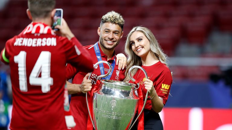 Liverpool's Alex Oxlade-Chamberlain (centre) celebrates the trophy during the UEFA Champions League final at the Wanda Metropolitano Stadium in Madrid, with Perry Edwards (right) and teammate Jordan Henderson (left) group photo.