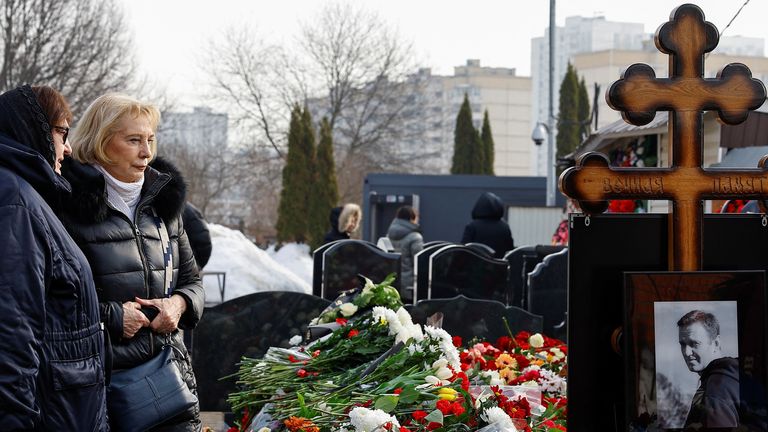 Russian opposition leader Alexei Navalny and his widow Yulia Navalnaya's mothers, Lyudmila and Alla, stand in front the grave of Alexei Navalny the day after the funeral at the Borisovskoye cemetery in Moscow, Russia, March 2, 2024. REUTERS/Stringer

