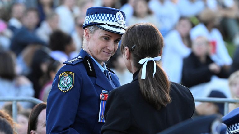 Amy Scott, who shot and killed the Sydney stabbing attacker, at the vigil. Pic: Reuters