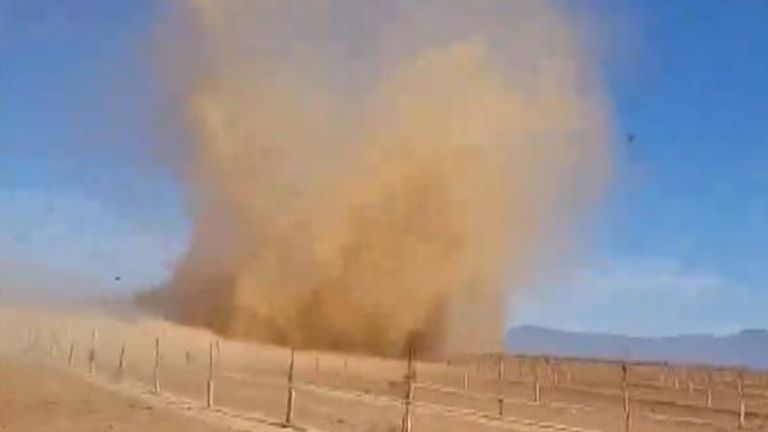 A large dust devil was spotted moving along Route 66 and flinging debris in western Arizona 