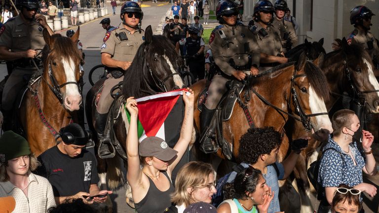 State troopers on horses push back demonstrators during a pro-Palestinian protest at the University of Texas Wednesday April 24, 2024 in Austin, Texas. Protests Wednesday on the campuses of at least two universities involved clashes with police, while another university shut down its campus for the rest of the week. (Mikala Compton/Austin American-Statesman via AP)