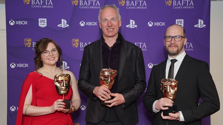 (L-R) Sarah Baylus, Swen Vincke and David Walgrave who won the best game award for Baldur&#39;s Gate 3