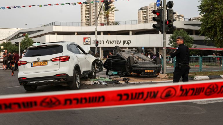 The car of Israel's National Security Minister Itamar Ben-Gvir is seen upturned after an accident near the area where a suspected stabbing incident took place, after he visited the scene, in Ramle, Israel April 26, 2024 REUTERS/Shannon Stapleton
