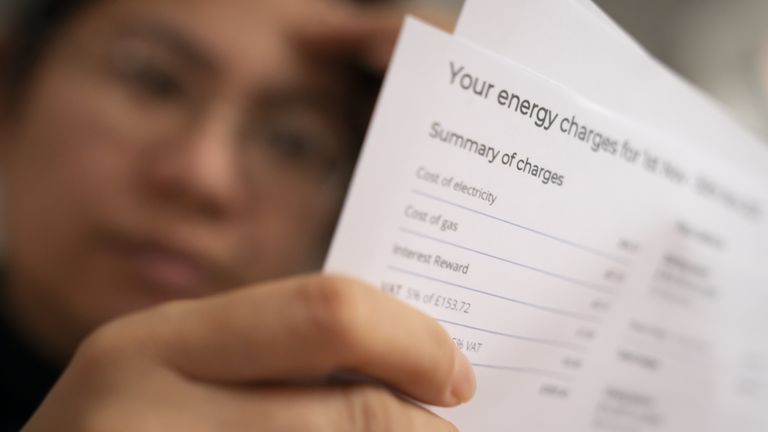 PICTURE POSED BY A MODEL File photo dated 08/01/22 of a person holding an energy bill. Households are about to see a host of essential bills rise steeply as firms roll out their annual April 1 price increases. Council tax, road tax, broadband, mobile, water and even stamps are all about to jump in price on or around the first of the month, with households urged to check for savings by shopping around and investigating if they are entitled to any discounts. Issue date: Saturday March 30, 2024.

