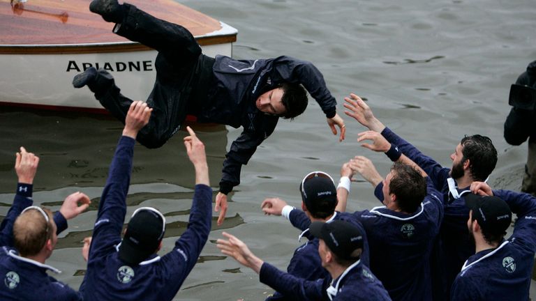 FILE - Members of the Oxford University rowing team throw their cox Nicholas Brodie, centre, into the river after beating Cambridge University, at the 154th annual Boat Race on the River Thames, London, Saturday, March 29, 2008. Jumping into London’s River Thames has been the customary celebration for members of the winning crew in the annual Boat Race between storied English universities Oxford and Cambridge. Now researchers say it comes with a health warning. (AP Photo/Lefteris Pitarakis, File