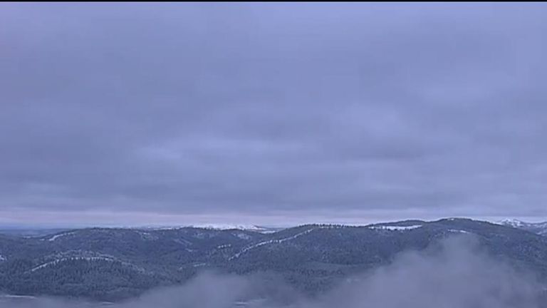 Timelapse footage shows  snow descending on Big Hill, a mountain peak in northern California