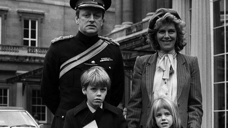 Camilla and Andrew Parker Bowles at Buckingham Palace in 1984 with their children to get his OBE from the Queen. Pic: PA