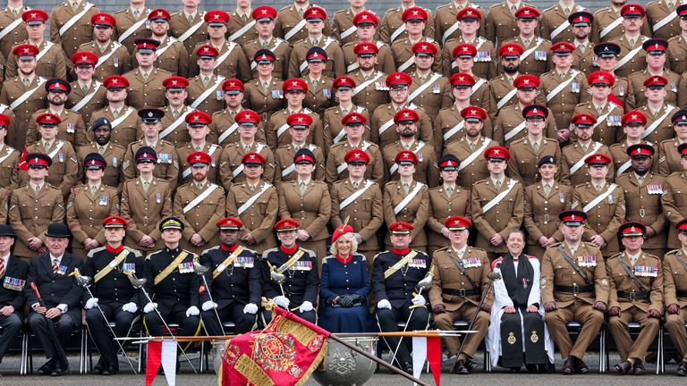 Queen Camilla poses for a group photograph with The Royal Lancers during a visit to The Royal Lancers.
Pic: Reuters