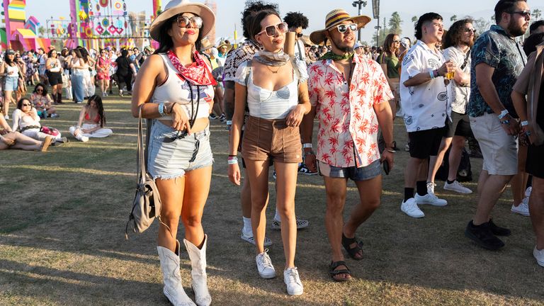 Festivalgoers are seen during the the first weekend of the Coachella Music and Arts Festival at the Empire Polo Club on Friday, April 12, 2024, in Indio, Calif. (Photo by Amy Harris/Invision/AP)