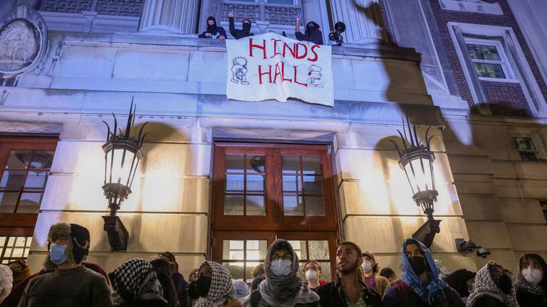 Protesters unfurled a flag with the words &#39;Hind&#39;s Hall&#39;. Pic: Reuters