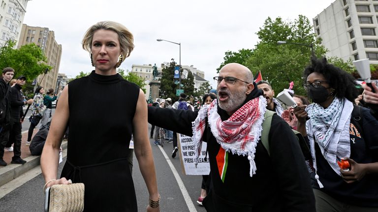 Demonstrators protest the Israel-Hamas war as a guest, left, arrives at the White House Correspondents&#39; Association Dinner at the Washington Hilton, Saturday April 27, 2024, in Washington. (AP Photo/Terrance Williams)