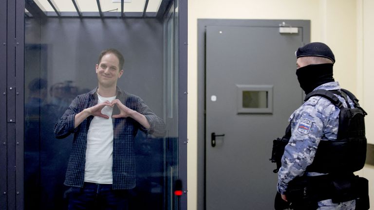 Wall Street Journal reporter Evan Gershkovich makes a heart-shaped gesture as he appears in court.
Pic Reuters