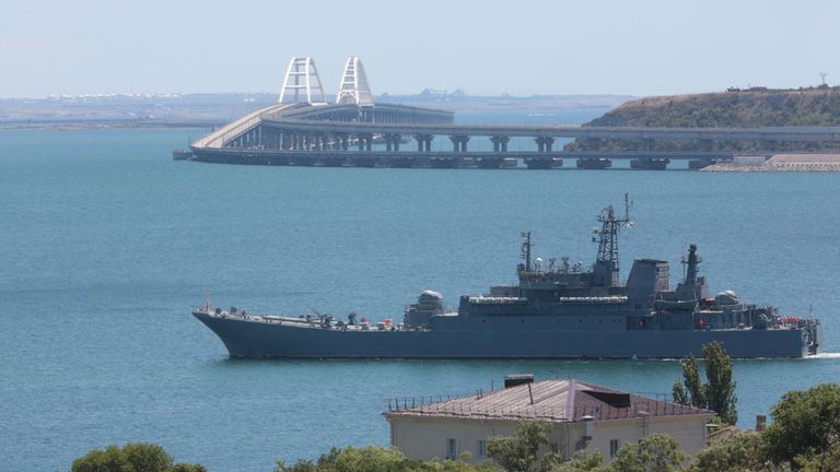 FILE - A Russian military landing ship, which now transports cars and people between Crimea and Taman because the Crimean Bridge connecting Russian mainland and Crimean peninsula over the Kerch Strait is closed, sails not far from Kerch, Crimea, on Monday, July 17, 2023. The Crimean Peninsula&#39;s balmy beaches have been vacation spots for Russian czars and has hosted history-shaking meetings of world leaders. And it has been the site of ethnic persecutions, forced deportations and political repres
