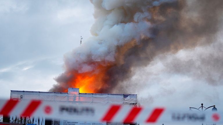 Smoke billows during a fire at the Old Stock Exchange, Boersen, in Copenhagen, Denmark.
Pic: Reuters