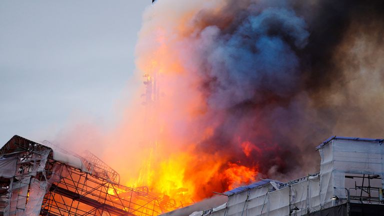 Smoke billows during a fire at the Old Stock Exchange, Boersen, in Copenhagen, Denmark.
Pic: Reuters
