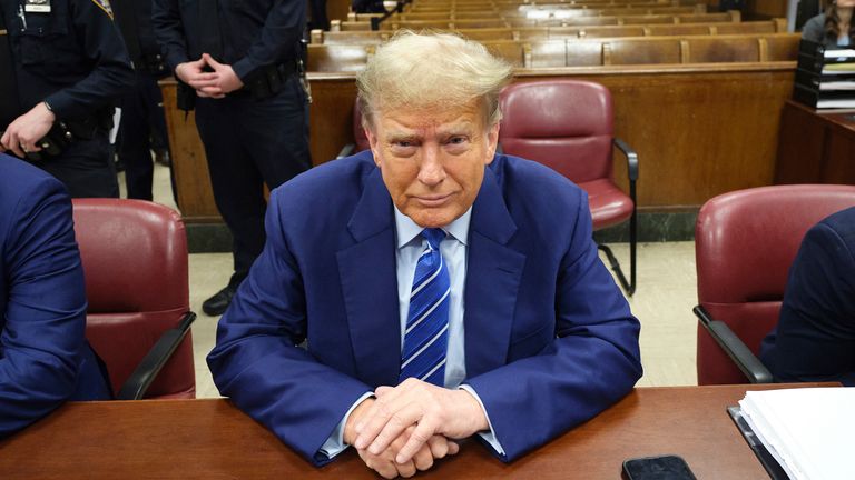 Former President Donald Trump awaits the start of proceedings on the second day of jury selection at Manhattan criminal court, Tuesday, April 16, 2024, in New York.  Trump returned to the courtroom Tuesday as a judge works to find a panel of jurors who will decide whether the former president is guilty of criminal charges alleging he falsified business records to cover up a sex scandal during the 2016 campaign. (Curtis Means/DailyMail.com via AP, Pool)