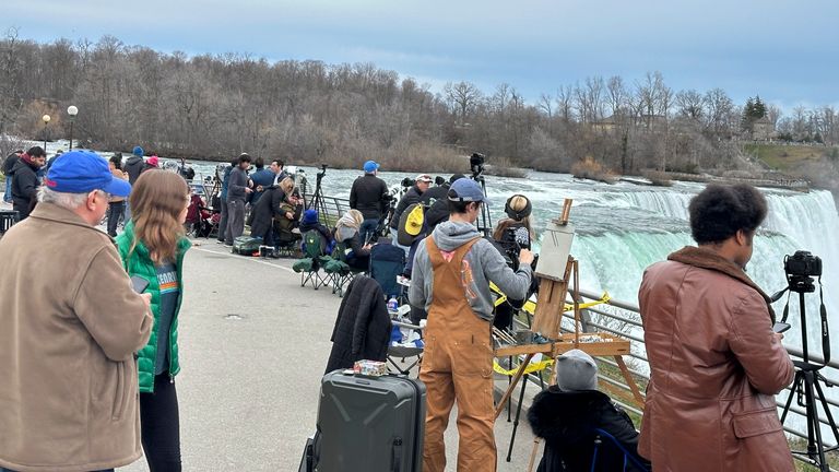 Groups of tourists streamed into Niagara Falls State Park to view the solar eclipse, Monday, April 8, 2024, in Niagara Falls, N.Y. Pic: AP Photo/Carolyn Thompson