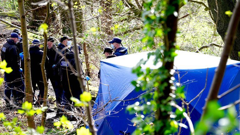 Police officers by a forensic tent at Kersal Dale.
Pic: PA