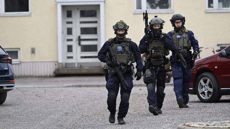 Armed police officers at the scene of the school shooting in Vantaa, Finland. Pic: Markku Ulander/Lehtikuva via AP