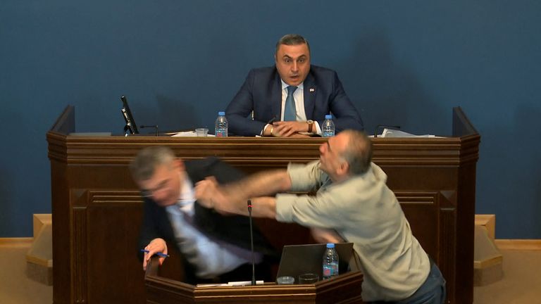 Mamuka Mdinaradze, leader of the ruling Georgian Dream party&#39;s parliamentary faction, is punched in the face by opposition MP Aleko Elisashvili.
Pic: Reuters