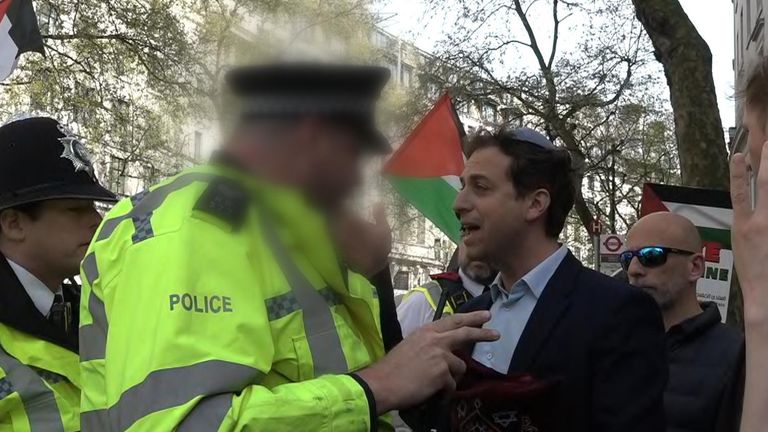 Gideon Falter speaks to Met Police officers during pro-Palestinian protests
